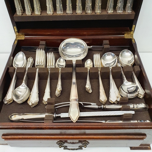 544 - A silver plated fiddle and shell pattern canteen of cutlery in a walnut case, 70 cm wide