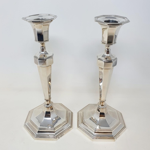 591 - A pair of silver octagonal table candlesticks, marks rubbed, probably Sheffield 1923, 26 cm high (2)