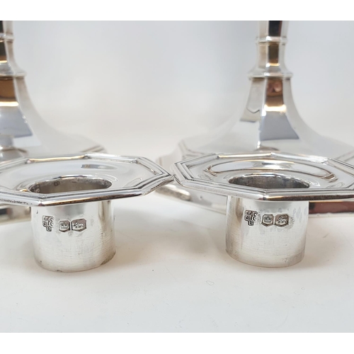 591 - A pair of silver octagonal table candlesticks, marks rubbed, probably Sheffield 1923, 26 cm high (2)