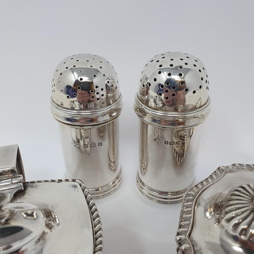 599 - A pair of silver pepperettes, Birmingham 1925/34, and two silver mustard pots, 8.3 ozt (4)