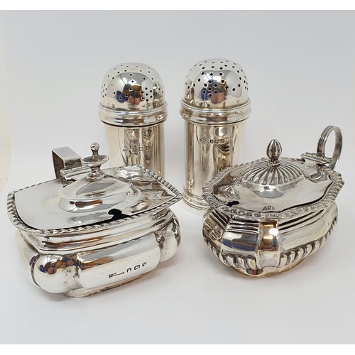 599 - A pair of silver pepperettes, Birmingham 1925/34, and two silver mustard pots, 8.3 ozt (4)