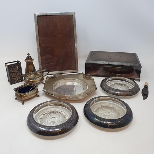 609 - A George V silver coaster, a three piece cruet, 7.8 ozt, three silver mounted glass coasters, a matc... 