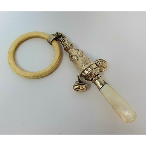 610 - An early 20th century silver coloured metal bone and mother of pearl baby's rattle, the stem in the ... 