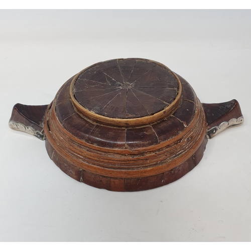 617 - An early 19th century Scottish treen quaich, with white metal mounts, 22 cm wide