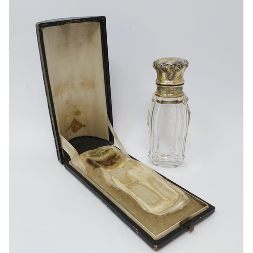 618 - A 19th century French silver gilt coloured metal and glass scent bottle, initialled, the body inscri... 