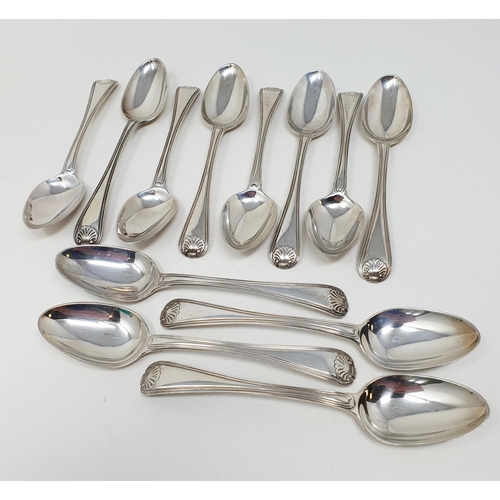 621 - A matched set of twelve silver thread and shell pattern spoons, various dates and makers, 10.7 ozt