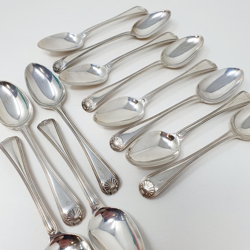 621 - A matched set of twelve silver thread and shell pattern spoons, various dates and makers, 10.7 ozt