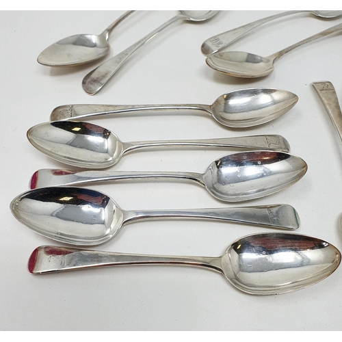 624 - A matched set of eleven silver Old English pattern dessertspoons, crested or initialed, various date... 