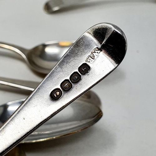 624 - A matched set of eleven silver Old English pattern dessertspoons, crested or initialed, various date... 