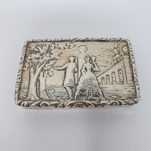 629 - A 19th century Dutch silver snuff box, the lid decorated with couple, 8 cm wide, 2.8 ozt