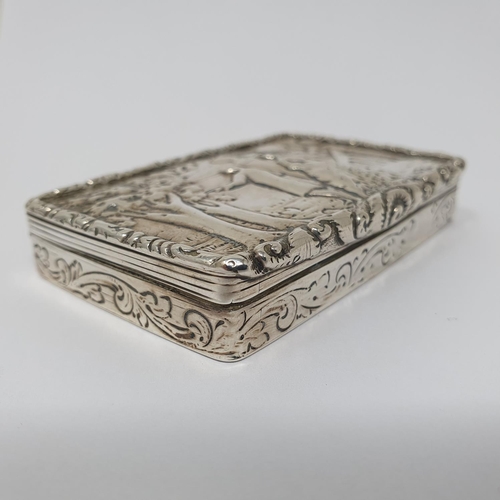 629 - A 19th century Dutch silver snuff box, the lid decorated with couple, 8 cm wide, 2.8 ozt