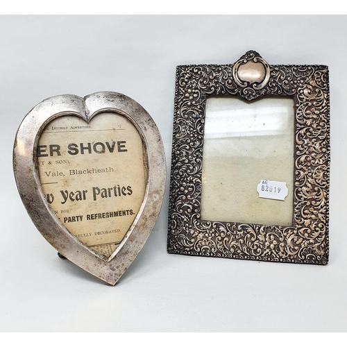 637 - A silver heart shaped strut photograph frame, London 1900, strut replaced, 18 cm high, and an emboss... 