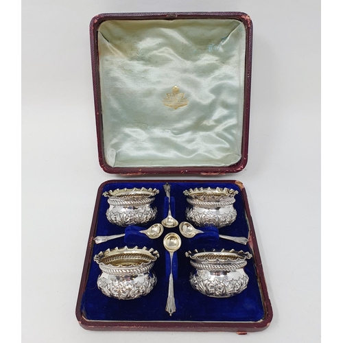 687 - A Victorian set of four silver salts, with spoons, cased