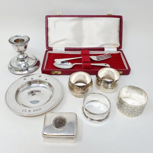 689 - Four silver napkin rings, and other small items of silver (qty)