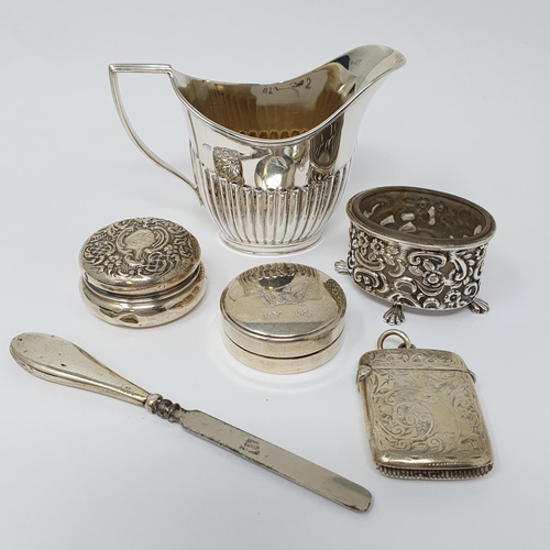 699 - A silver cream jug, Sheffield 1894, a silver vesta case, and other small items of silver (6)