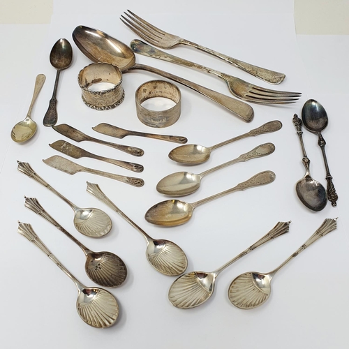 706 - A Georgian Old English silver spoon, assorted flatware, and two napkin rings, 15.5 ozt