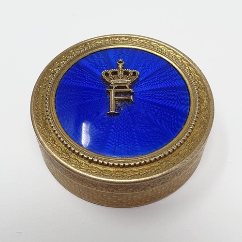 707 - A Continental silver gilt and blue enamel pill box, stamped A H. NAGUIB BUY, 4.5 cm diameter