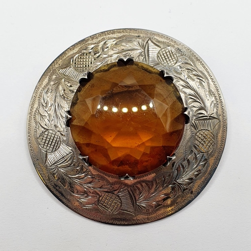 800 - A Scottish silver and yellow stone brooch