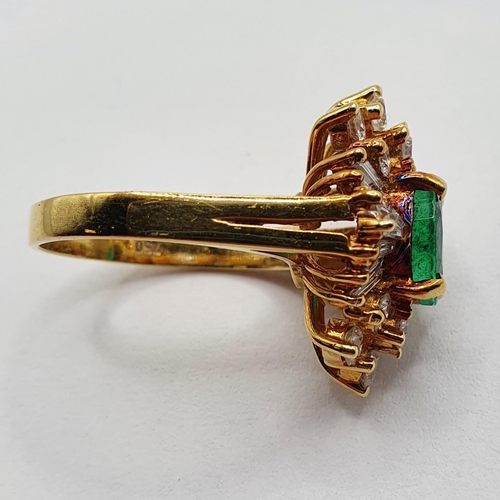 803 - An 18ct gold, emerald and diamond ring, ring size M