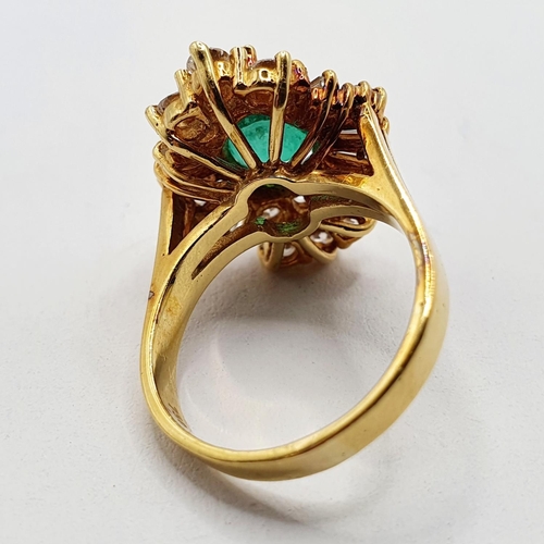 803 - An 18ct gold, emerald and diamond ring, ring size M