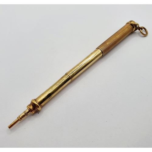 808 - A gilt coloured metal propelling pencil, the top inset with a bloodstone