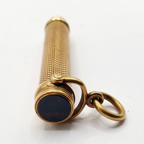 808 - A gilt coloured metal propelling pencil, the top inset with a bloodstone