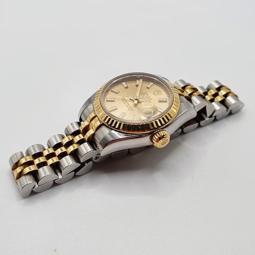 752 - A ladies stainless steel and gold Rolex Oyster Perpetual Datejust wristwatch, with a champagne dial ... 