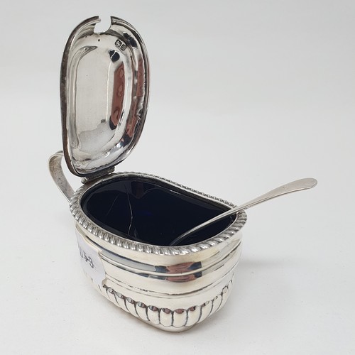 440 - An Edward VII silver mustard pot and spoon, Chester 1902, with a blue glass liner  Provenance: From ... 