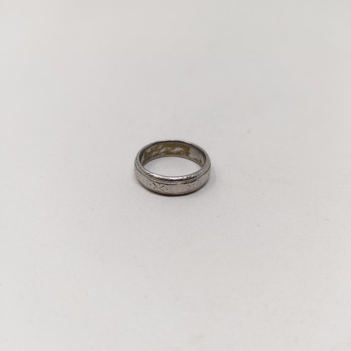 813 - A platinum wedding band,  7.3 g