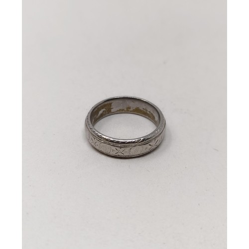 813 - A platinum wedding band,  7.3 g