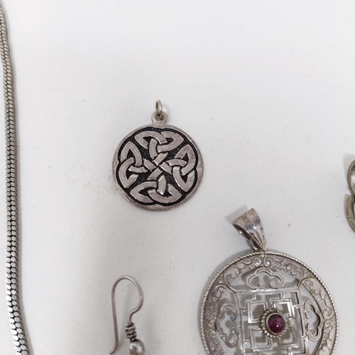 998A - A Tibetan pendant, and matching earrings, a silver pendant, and assorted jewellery