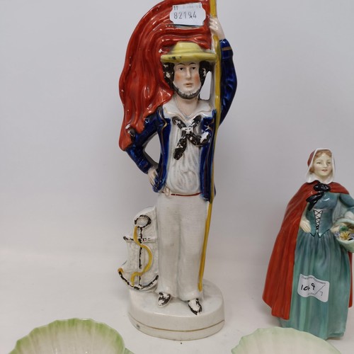 1049 - A Staffordshire figure of a soldier and a sailor, 33 cm high, a Royal Doulton figure, Jean and Mr Pi... 