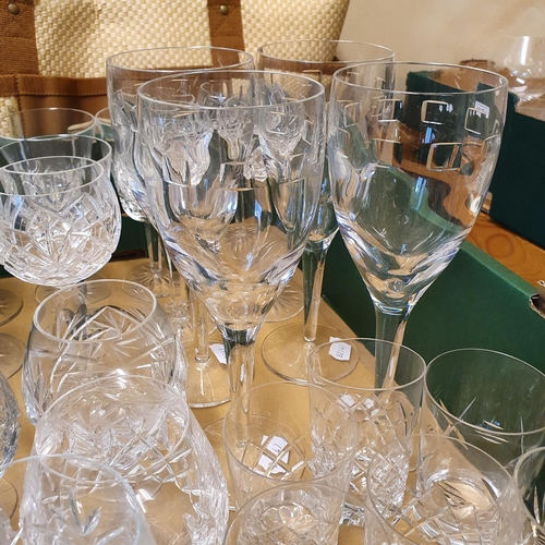 1005 - A set of four Waterford wine glasses, other glassware, a picnic set, and a box of assorted linen (5 ... 