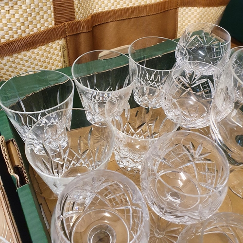 1005 - A set of four Waterford wine glasses, other glassware, a picnic set, and a box of assorted linen (5 ... 