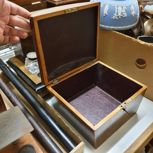 1039 - An early 20th century walnut desk stand, with glass inkwells with silver mounts, 30 cm wide, a domed... 