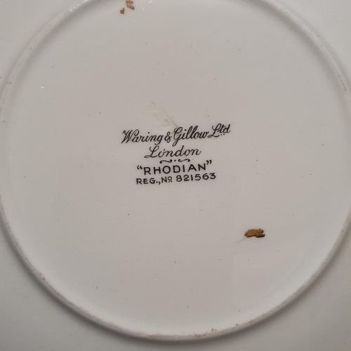 1054 - A part dinner service, with retail mark for Waring & Gillow (box)