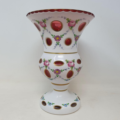 1179 - A cased glass vase, decorated flowers, 22 cm high