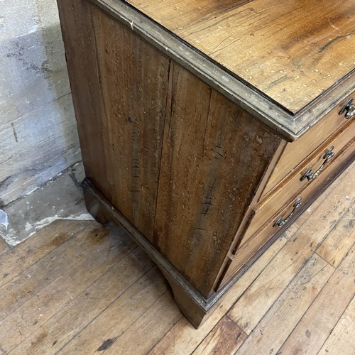 1303 - A walnut chest, having two short and two long drawers, two chairs,