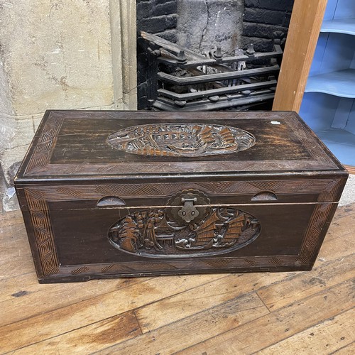 1301 - A carved camphorwood trunk, 90 cm wide, a pine bookcase, two trunks, a corner cupboard and a stool (... 