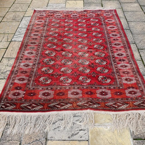 1218 - ***WITHDRAWN***A Turkish red ground carpet, 235 x 186 cm