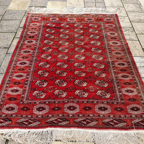 1218 - ***WITHDRAWN***A Turkish red ground carpet, 235 x 186 cm