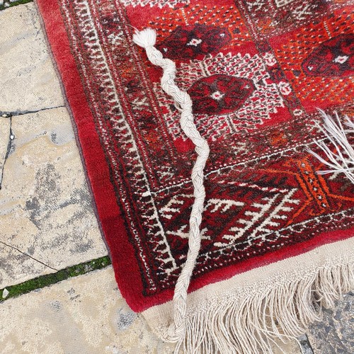 1218 - ***WITHDRAWN***A Turkish red ground carpet, 235 x 186 cm