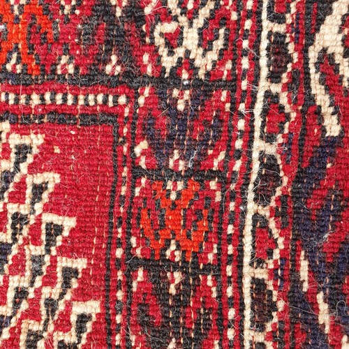 1218 - ***WITHDRAWN***A Turkish red ground carpet, 235 x 186 cm