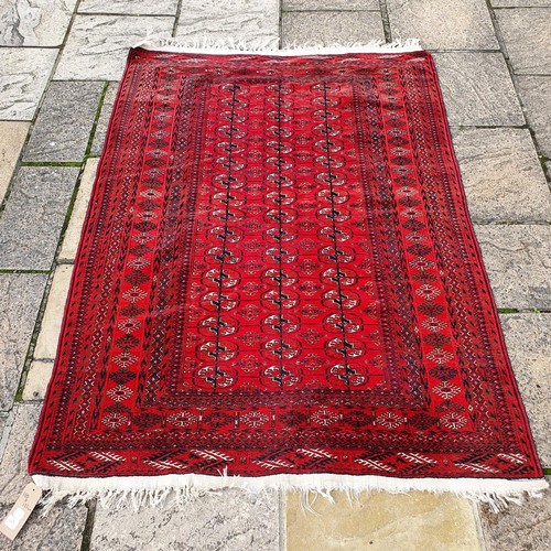 1217 - ***WITHDRAWN***A Turkish red ground rug, 180 x 123 cm