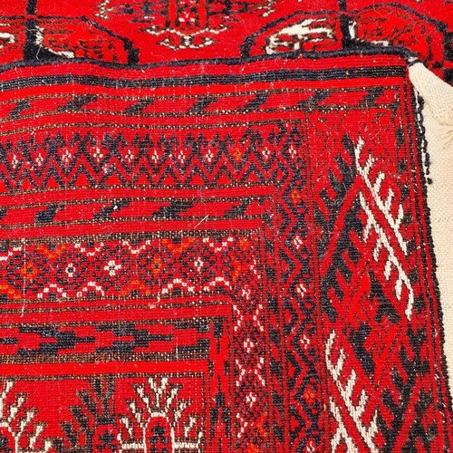 1217 - ***WITHDRAWN***A Turkish red ground rug, 180 x 123 cm