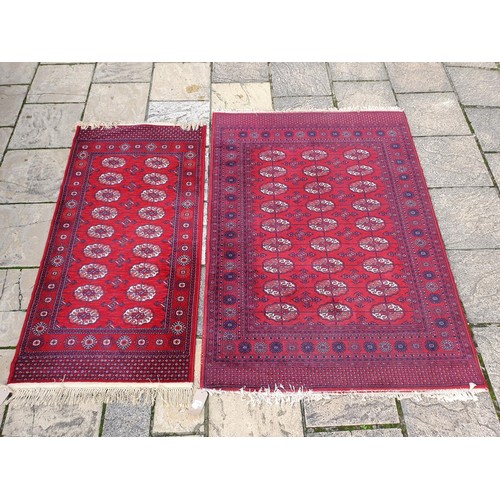 1219 - ***WITHDRAWN***A red ground rug, 176 x 93 cm, and rose ground carpet, 200 x 140 cm (2)