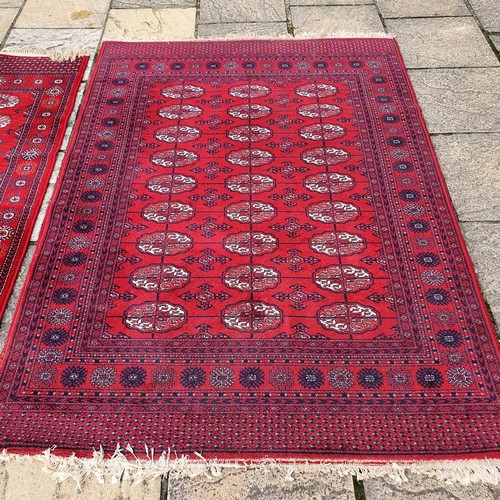 1219 - ***WITHDRAWN***A red ground rug, 176 x 93 cm, and rose ground carpet, 200 x 140 cm (2)