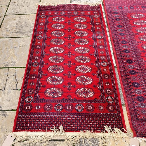 1219 - ***WITHDRAWN***A red ground rug, 176 x 93 cm, and rose ground carpet, 200 x 140 cm (2)