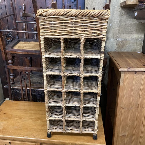 1302 - An oak coffer, 103 cm wide, four chairs, a child's chair, a wicker wine rack, and a chest of drawers... 