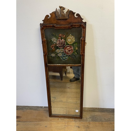 1314 - A walnut pier mirror, with a painted panel, decorated flowers, 120 x 41 cm